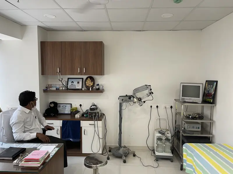 ENT examination area at Hallmark Speciality ENT Clinic with an operating microscope, monitor and examination couch